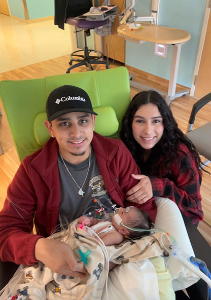 Rebecca Velazquez and boyfriend Fernando hold their new son, Jeremiah at CHRISTUS Children's