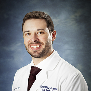 A headshot of Zachary Sumner