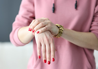 Woman holding her wrist in pain