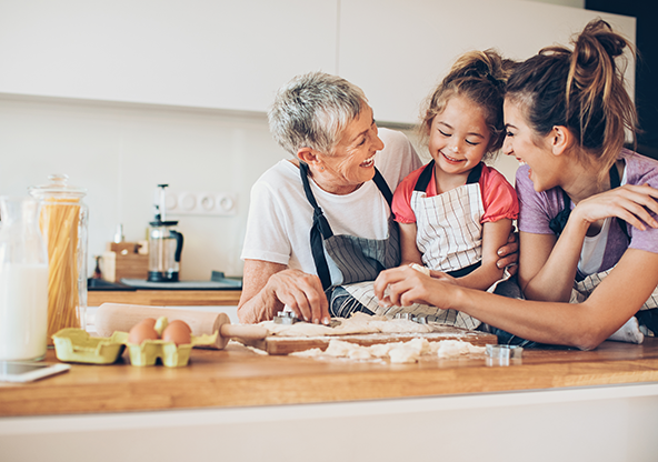 Three generations of women cooking